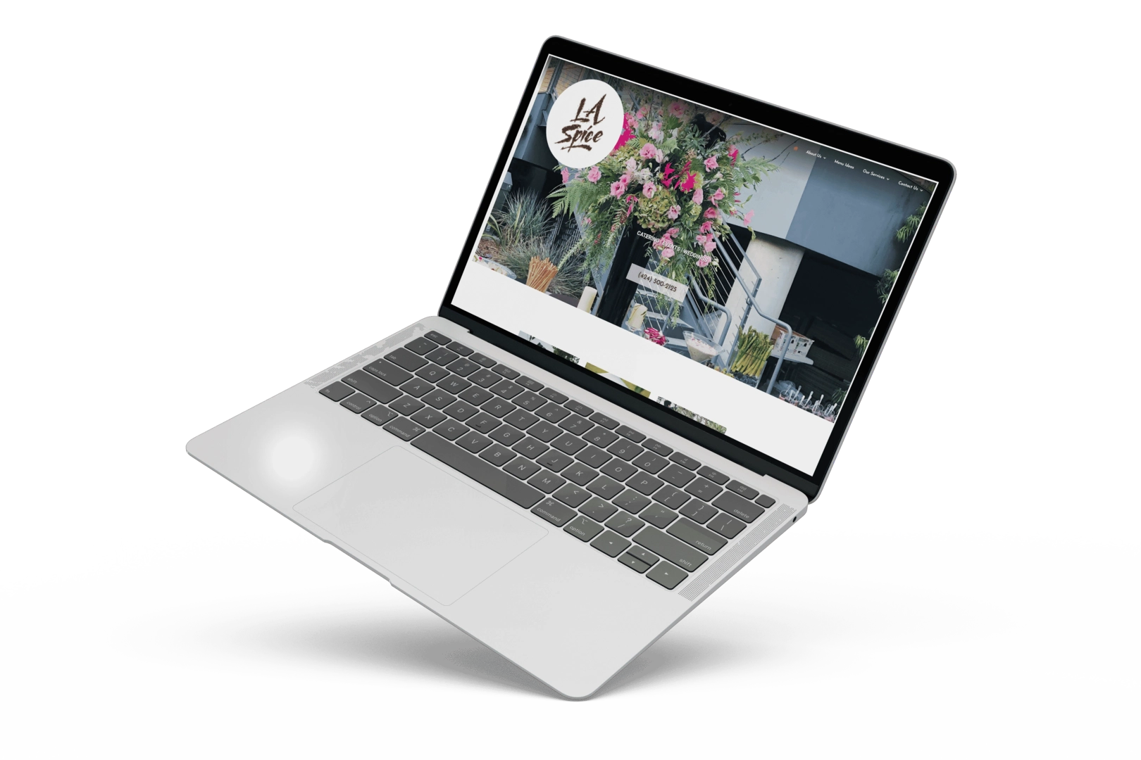 An image of a laptop showcasing LA Spice Catering's portfolio.
