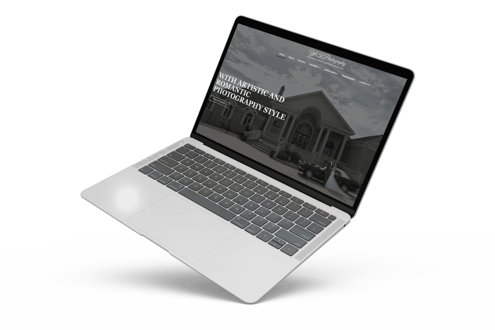 A laptop computer with a YK Photography website on it.